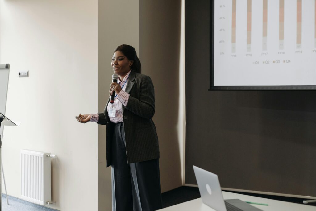 Businesswoman delivering an engaging presentation at a conference.